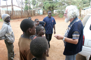 Fr. kizito talking to the children