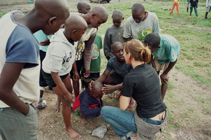 Mthunzi boys chatting with Amani volunteers during one of the previous  work camps.   